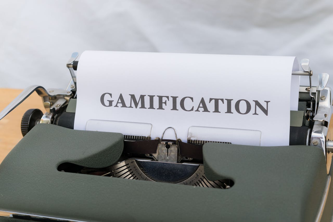 Close-up of a vintage typewriter displaying the word Gamification on paper.